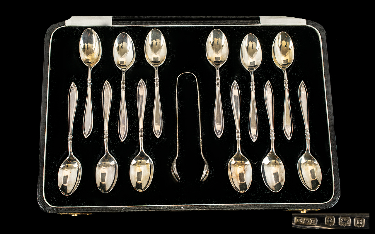 1920's Boxed Set of 12 Sterling Silver Teaspoons + Matching Sugar Nips.