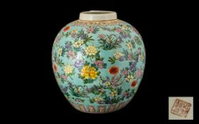 A Globular Shaped Oriental Vase powder blue ground with blossom throughout. height 11 inches.