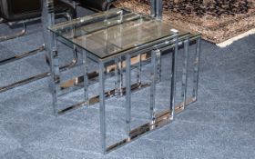 Contemporary Nest of Three Tables tinted glass top on square chrome supports, the smallest being 21.