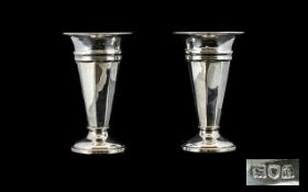 A Pair of Solid Silver Vases with Tapered Columns and Flared Necks, Raised on a Circular Base.