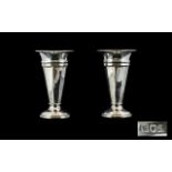 A Pair of Solid Silver Vases with Tapered Columns and Flared Necks, Raised on a Circular Base.