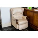 Cream Leather Electric Recliner Chair with wooden arms and raised on wheels.