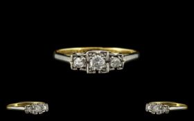 18ct and Platinum 3 Stone Diamond Set Ring of Pleasing Form. From the 1920's.