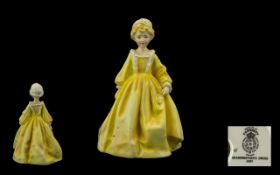 Royal Worcester Figure. 'Grandmother's Dress'. Pretty lady in a yellow dress and white bonnet.