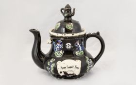 Small Bargeware Teapot in decorative design with 'Home Sweet Home' on front and rear of pot.