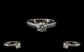 A Single Stone White Gold Diamond Ring Set with a round modern brilliant cut diamond,