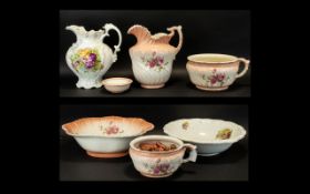 A Collection Of Floral Ceramic Vanity Items To include two large water jugs, soap dish,