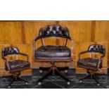 A Mahogany And Leather Captains Chair Of traditional form and generous proportion,