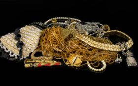 A Mixed Collection Of Costume Jewellery To include a yellow multi-strand bugle bead necklace,