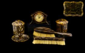 A Collection of Faux Tortoiseshell Dressing Table Items comprising brush, bedside table clock,