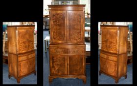 A Mid 20th Century Cocktail Cabinet - bow fronted top with integral mirror and top above a mirrored