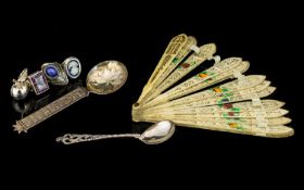 A Small Mixed Lot comprising three white metal paste set rings, Continental silver mustard spoon,