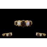 A 9ct Gold Opal And Garnet Set Ring Fully hallmarked for 9ct gold,