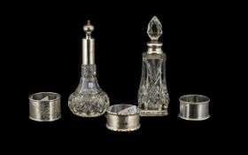 Mixed Lot of Silver to include three single napkin rings and a two scent bottles,