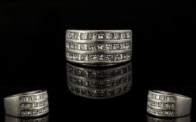 Platinum And Diamond Set Superb And Attractive Contemporary Ring Comprising three rows of ten