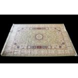 A Very Large Woven Silk Carpet Keshan rug with cream ground and green border with traditional