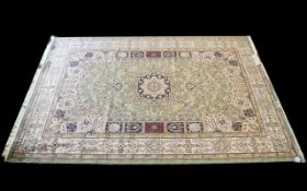 A Very Large Woven Silk Carpet Keshan rug with cream ground and green border with traditional