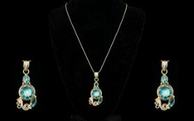 A Silver And Swiss Topaz Set Pendant Necklace Freeform scroll detail pendant drop set to the centre