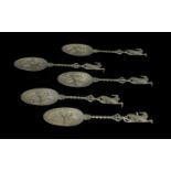 Five Dutch Pewter Decorative Spoons Each with figural design embossed bowl,