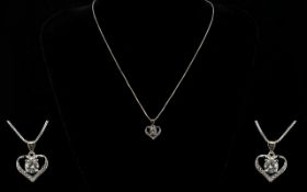 A Contemporary Silver And CZ Set Pendant Necklace Fine link chain with open heart pendant set to