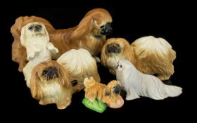 Collection of Six Ceramic Pekingese Dog Figures, including Royal Doulton.