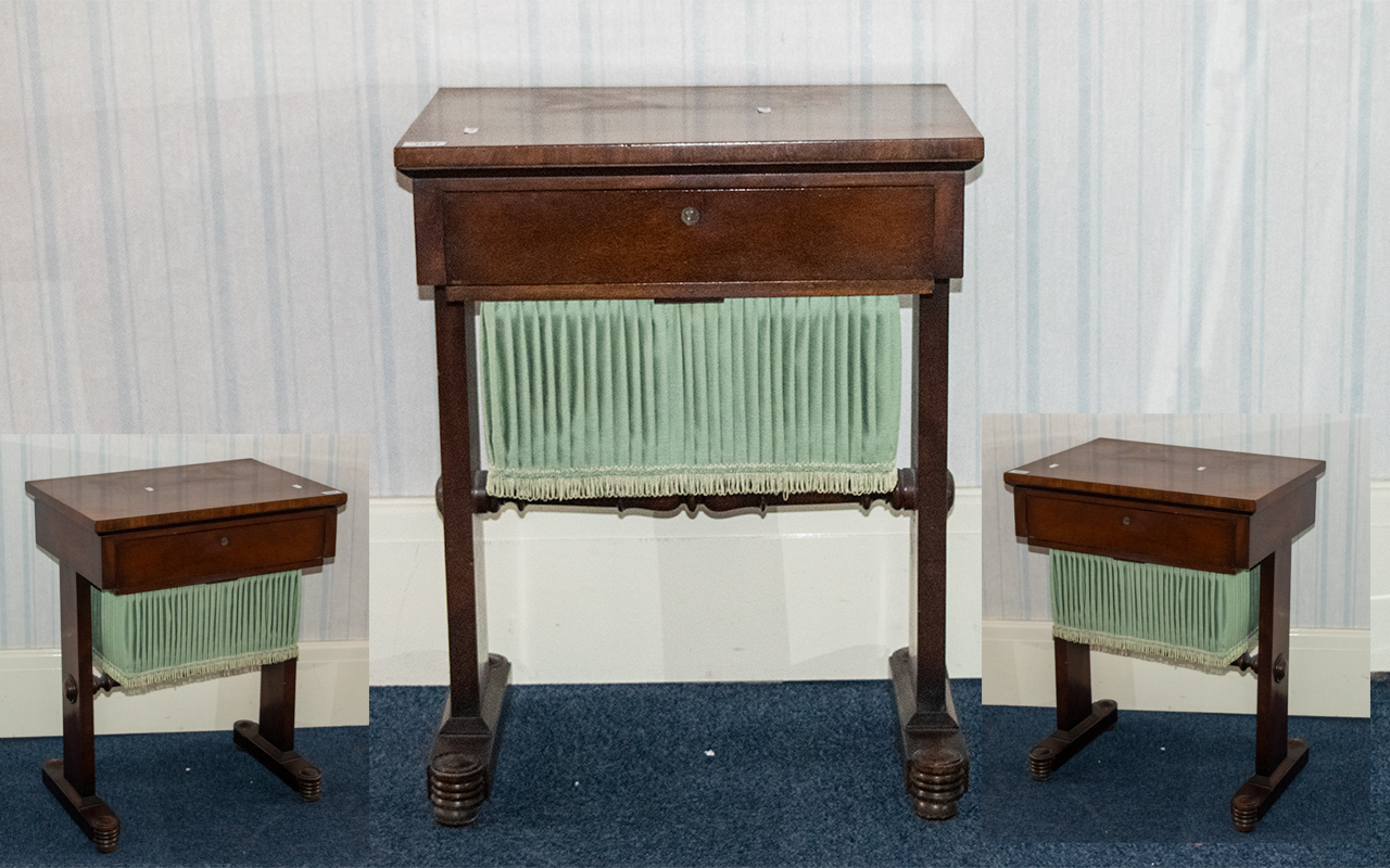 A Ladies Mahogany Work Table, frieze drawer and a sliding silk liner.