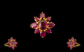 Ruby Flower Shape Ring, the centre oval cut ruby, of 3.