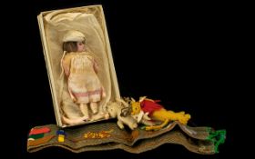 A Collection of Vintage Toys Comprising of a vintage porcelain headed doll with moving eyes,