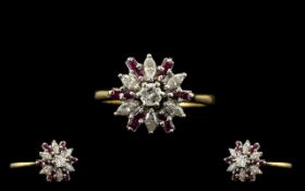 18ct Gold Diamond and Ruby Set Ladies Ring of starburst design. Marked 750-18ct.