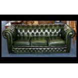 Chesterfield Three Seater Settee with three drop in seats, Raised on castors.