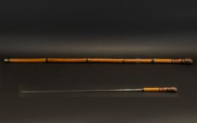 SWORD STICK. 19th century French bamboo sword stick, has ST ETIENNE on one side of blade with F.