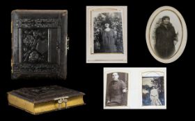 A Victorian Carte De Visite Album Embossed floral leather album with bass hardware containing