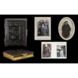 A Victorian Carte De Visite Album Embossed floral leather album with bass hardware containing