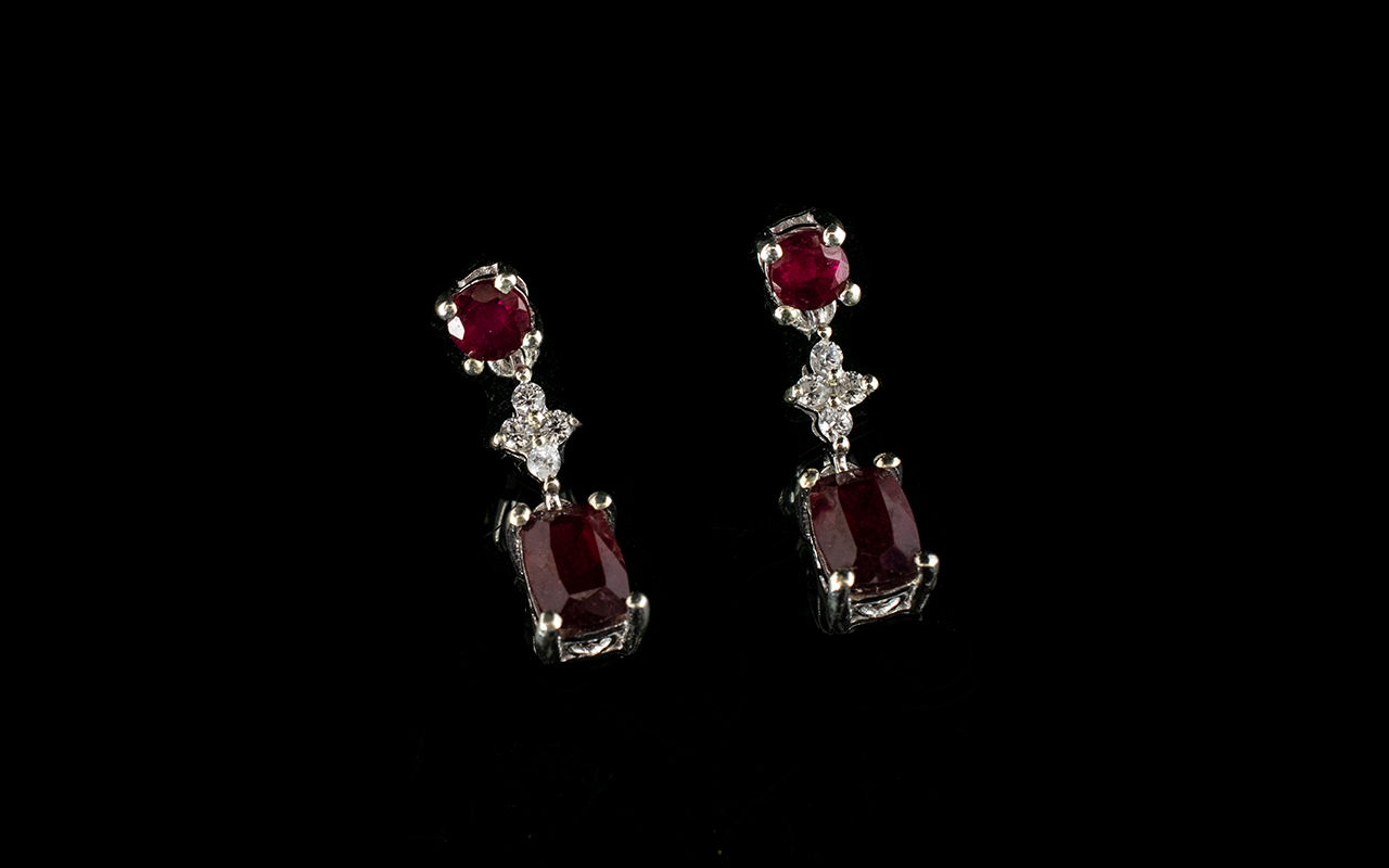 Ruby and Cambodian Zircon Drop Earrings, each earring having a cushion cut ruby, of over 1ct,