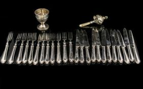 A Set of 12 Forks and Dessert Knives (24) pieces.