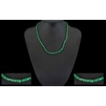 A Freeform Emerald Necklace With 18ct Gold Clasp Comprising multiple small faceted beads,