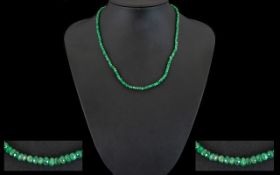 A Freeform Emerald Necklace With 18ct Gold Clasp Comprising multiple small faceted beads,