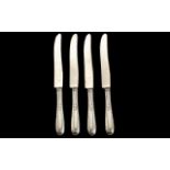 A Set of Four Sterling Silver Handled Kn