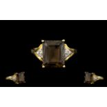 Ladies 9ct Gold - Attractive Step Cut Topaz and Diamond Set Dress Ring,
