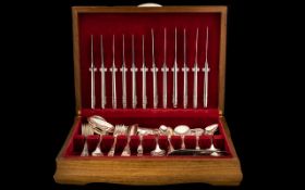 Canteen of Silver Plated Cutlery. 80 pieces housed in a teak box, please see accompanying image.