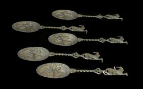 Five Dutch Pewter Decorative Spoons Each with figural design embossed bowl, twisted curlicue stem