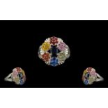Blue and Multi Colours of Sapphire Cluster Ring, an oval cut deep blue sapphire set to the centre,