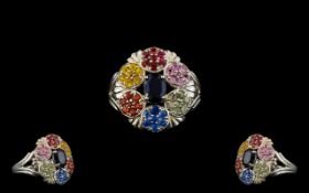 Blue and Multi Colours of Sapphire Cluster Ring, an oval cut deep blue sapphire set to the centre,