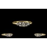 18ct Gold and Platinum Set Diamond Set Ring - From the 1930's. Marked 18ct Gold and Platinum. The