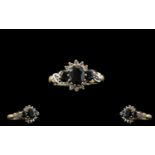 9ct Gold Attractive Diamond And Sapphire Set Dress Ring The central sapphire surrounded by 10