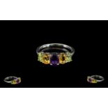 Amethyst, Citrine and Peridot Band Ring, an oval cut amethyst of .