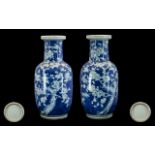 A Pair of Antique Large Blue and White Chinese Vases decorated with prunus blossom,