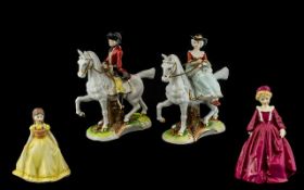 Four Porcelain Figures comprising two vintage Regency style figures of a Lady and Gentleman on