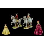 Four Porcelain Figures comprising two vintage Regency style figures of a Lady and Gentleman on