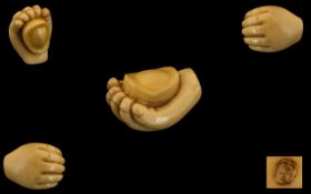 Oriental Netsuke in the Form of an Open Hand. Signed to base. Length 1.5 inches.